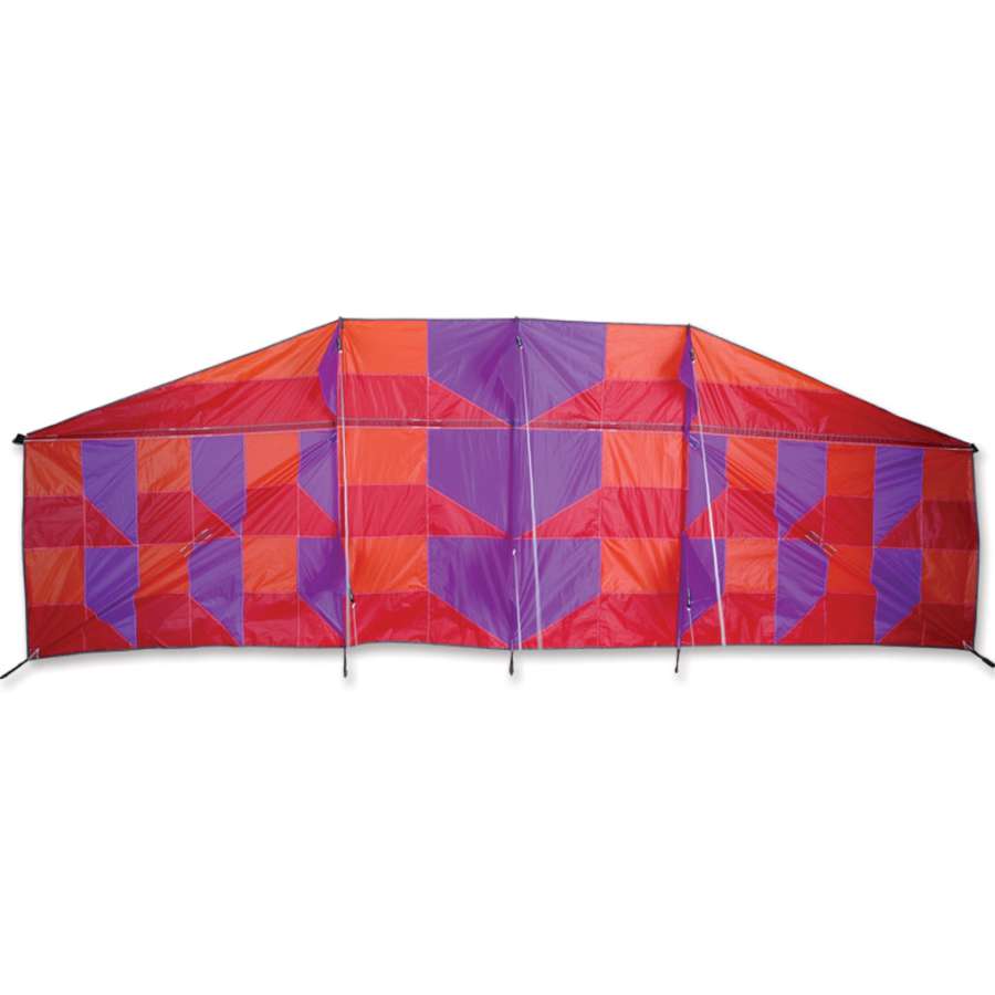 Genki Kite soaring in the sky, measures 38 x 114 inches, featuring vibrant colors and patterns inspired by Reza Ragheb.