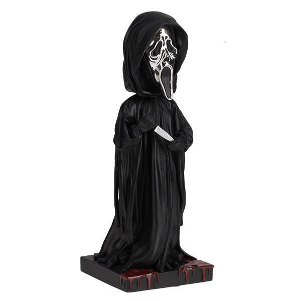 Ghost Face Silver Chrome Mask Bobblehead stands 8 inches tall with a glossy silver finish, showcasing intricate details and features typical of this iconic horror character.
