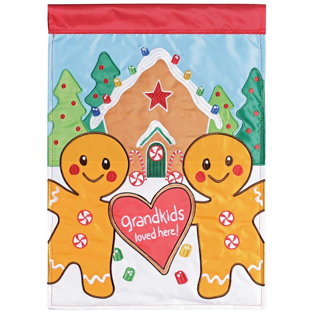Grandkids Loved Here garden flag featuring colorful appliques and embroidery displayed on a flagpole in a sunny garden setting.