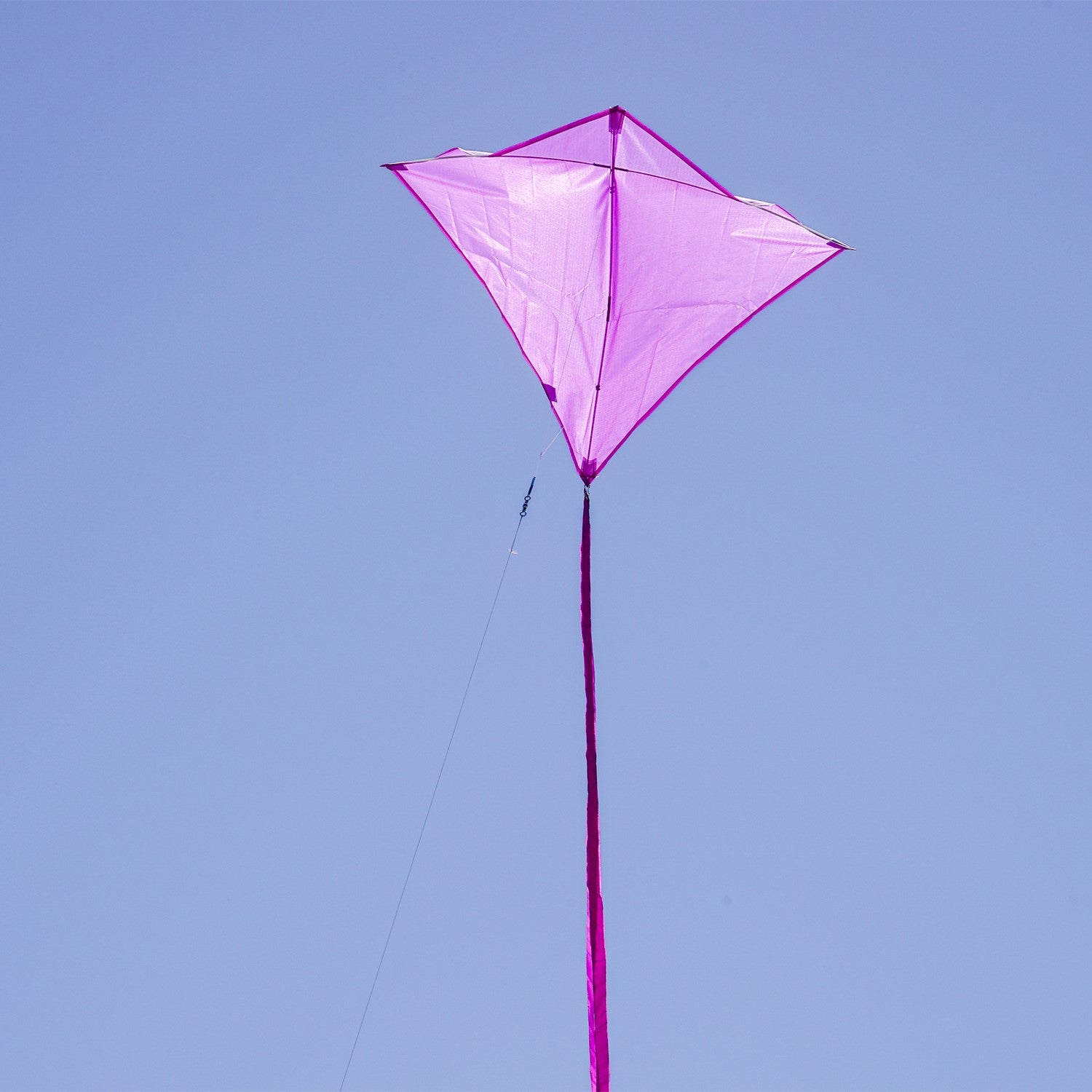 Grape Colorfly 30-inch diamond kite soaring in the sky against a blue backdrop, showcasing its vibrant grape color and stability.