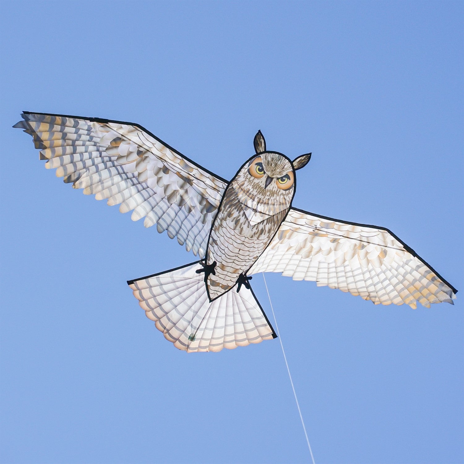 70-inch Great Horned Owl Kite featuring a realistic design with iconic plumicorns and talons soaring against a clear blue sky.