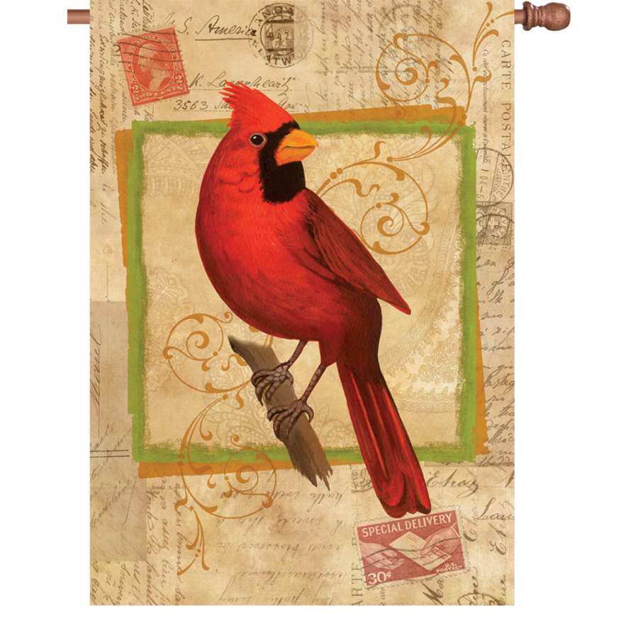 28 in. Happy Cardinal flag showcasing a colorful, illuminated design hanging in an outdoor garden setting, adding brightness to the decor.