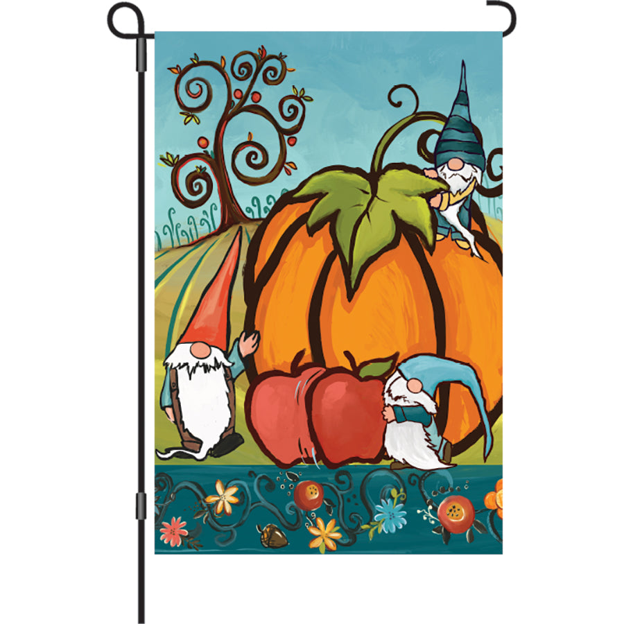 12 in. illuminated Harvest Gnomes garden flag with vibrant autumn designs displayed in a garden setting, complementing fall decorations.