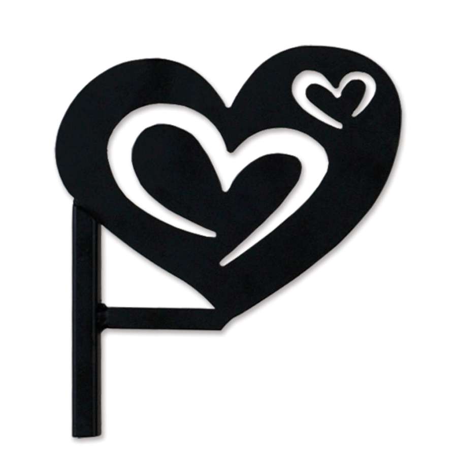 Hearts Flag Finial, a decorative 5-inch metal accent featuring intertwined heart design, installed on a garden flag pole outdoors.
