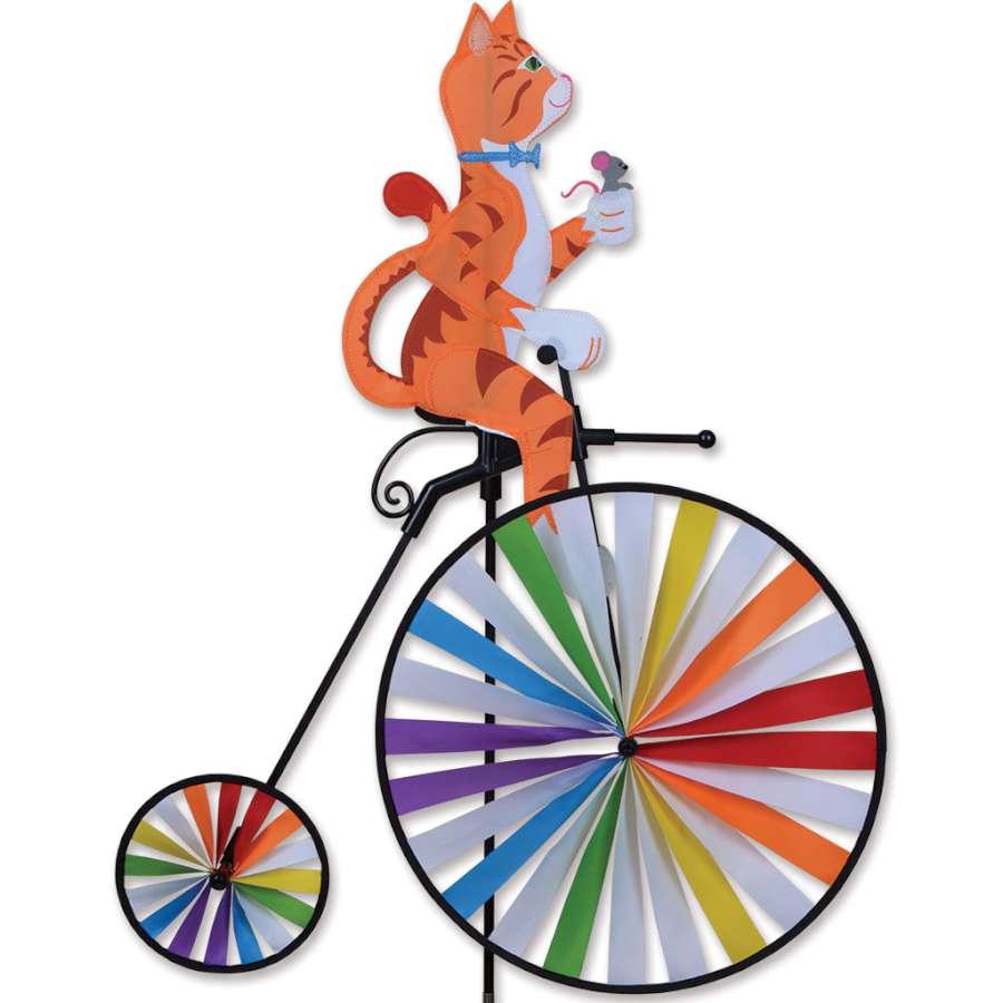 High Wheel Bike Spinner with a cat motif, featuring large 30-inch wheel, spinning gracefully in an outdoor garden setting.