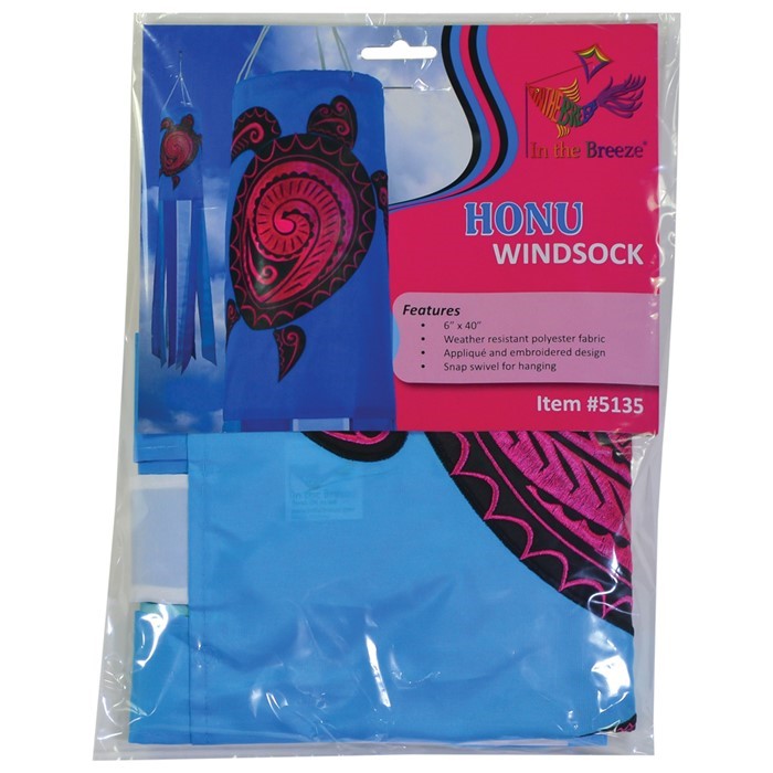 Honu (Turtle) 40-inch windsock with colorful Hawaiian design and vibrant embroidered accents fluttering in a gentle breeze in a garden setting.