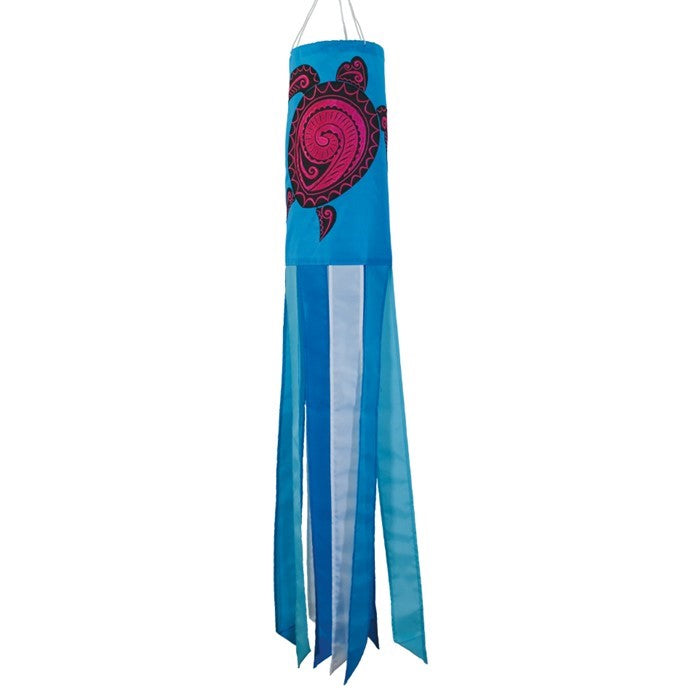 Honu (Turtle) 40-inch windsock with colorful Hawaiian design and vibrant embroidered accents fluttering in a gentle breeze in a garden setting.