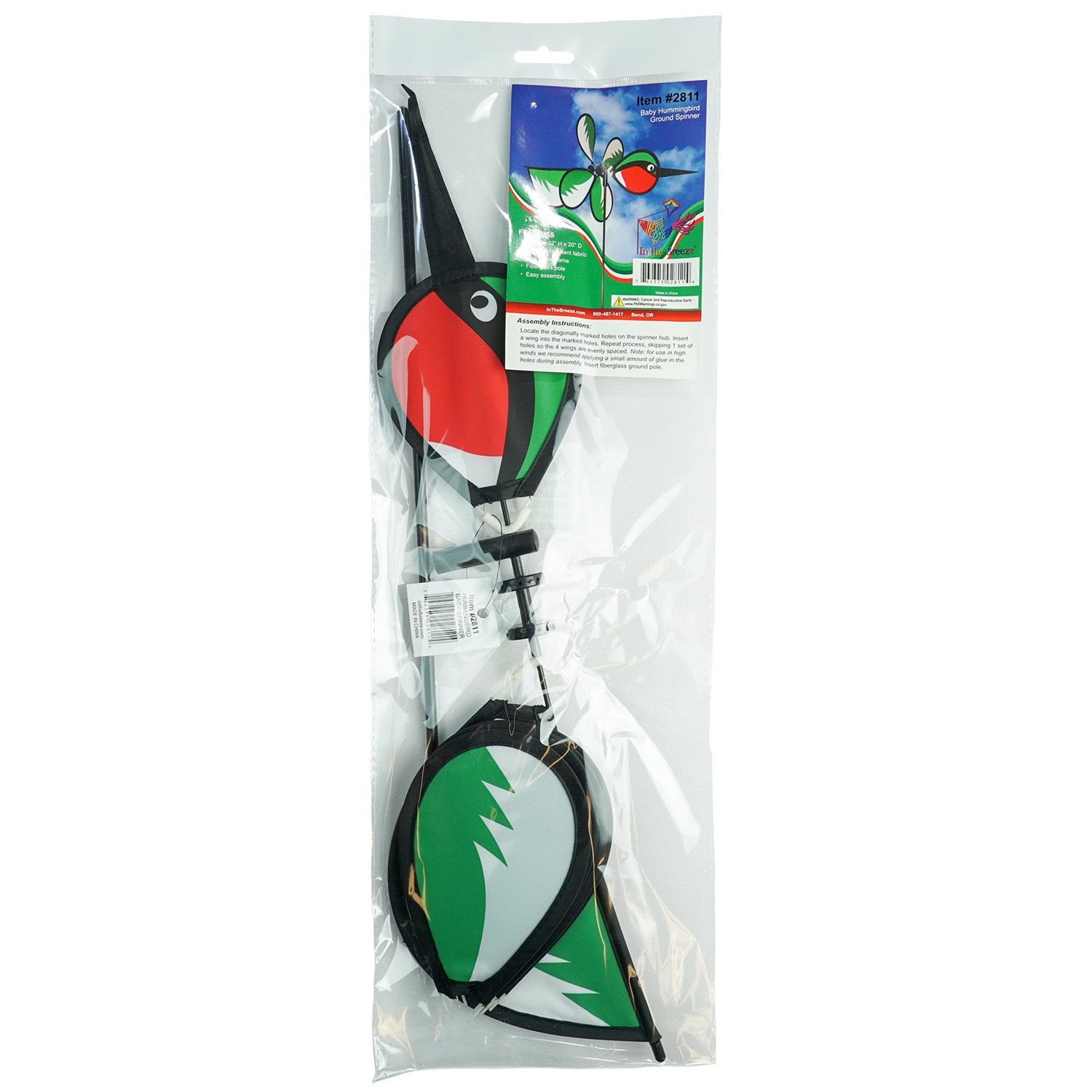 Hummingbird Baby Spinner with colorful design displayed outdoors, showcasing a vibrant baby hummingbird spinning in the garden.