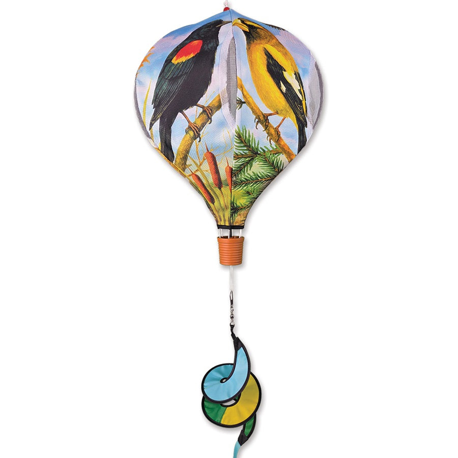 Alt Text: 19 in. Pop-Open Hot Air Balloon featuring Northwest bird designs spinning on a deck, showcasing colorful outdoor decor in motion.