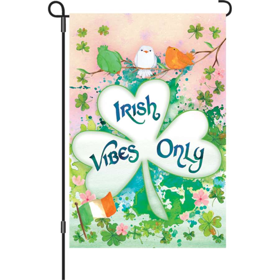 12 in. Irish Vibes Only garden flag made from soft fabric, displaying vibrant text and festive design in a garden setting.