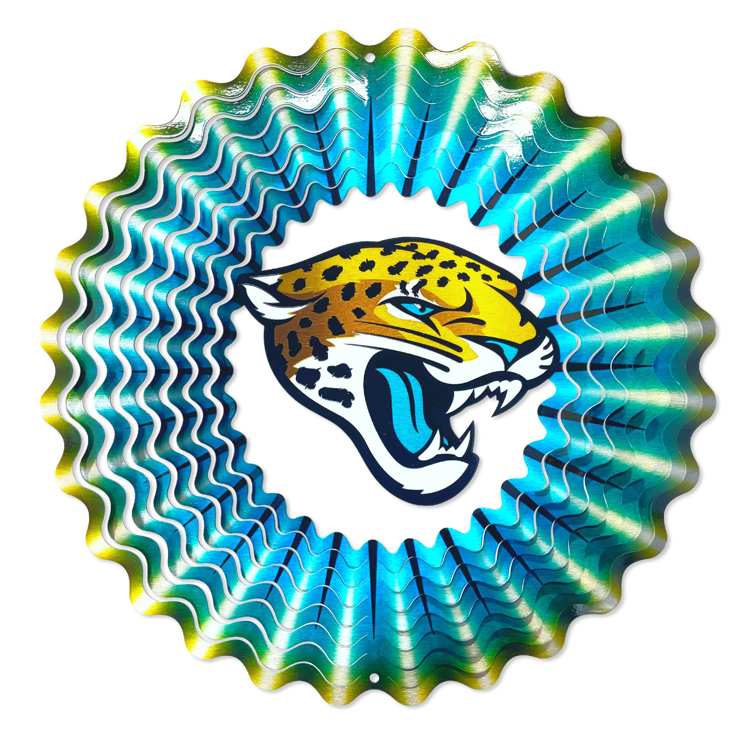 Jacksonville Jaguars NFL Wind Spinner featuring a 12-inch design with vibrant team colors, displayed in an outdoor garden setting.
