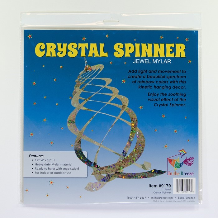 The Jewel Crystal Spinner displaying five reflective blades glimmering in sunlight, creating a spectrum of colors as it spins in a gentle breeze.