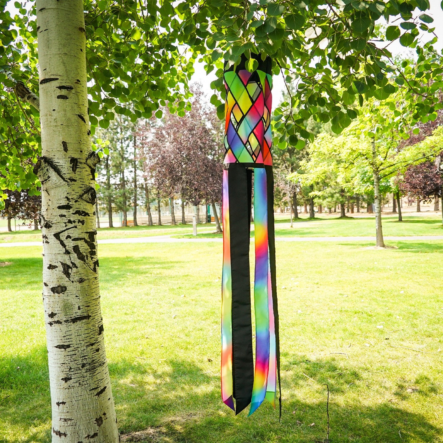 Brightly colored Jewel Diagonal Weave 60" Windsock showcasing jewel tones and black tails fluttering in the breeze, perfect for outdoor decor.