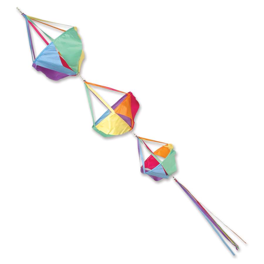 Vibrant Jumbo Spinnie Set - Circus with colorful designs and matching streamer tails spinning in the wind on display in a garden setting.