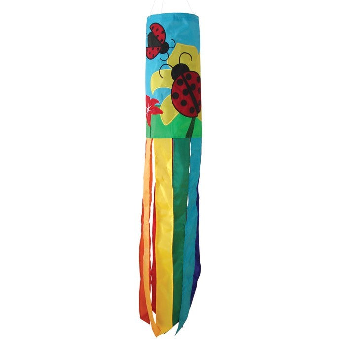 A stunning Ladybug Flower 40" windsock featuring vibrant colors and detailed appliqued graphics, fluttering gracefully with eight coordinating tails.