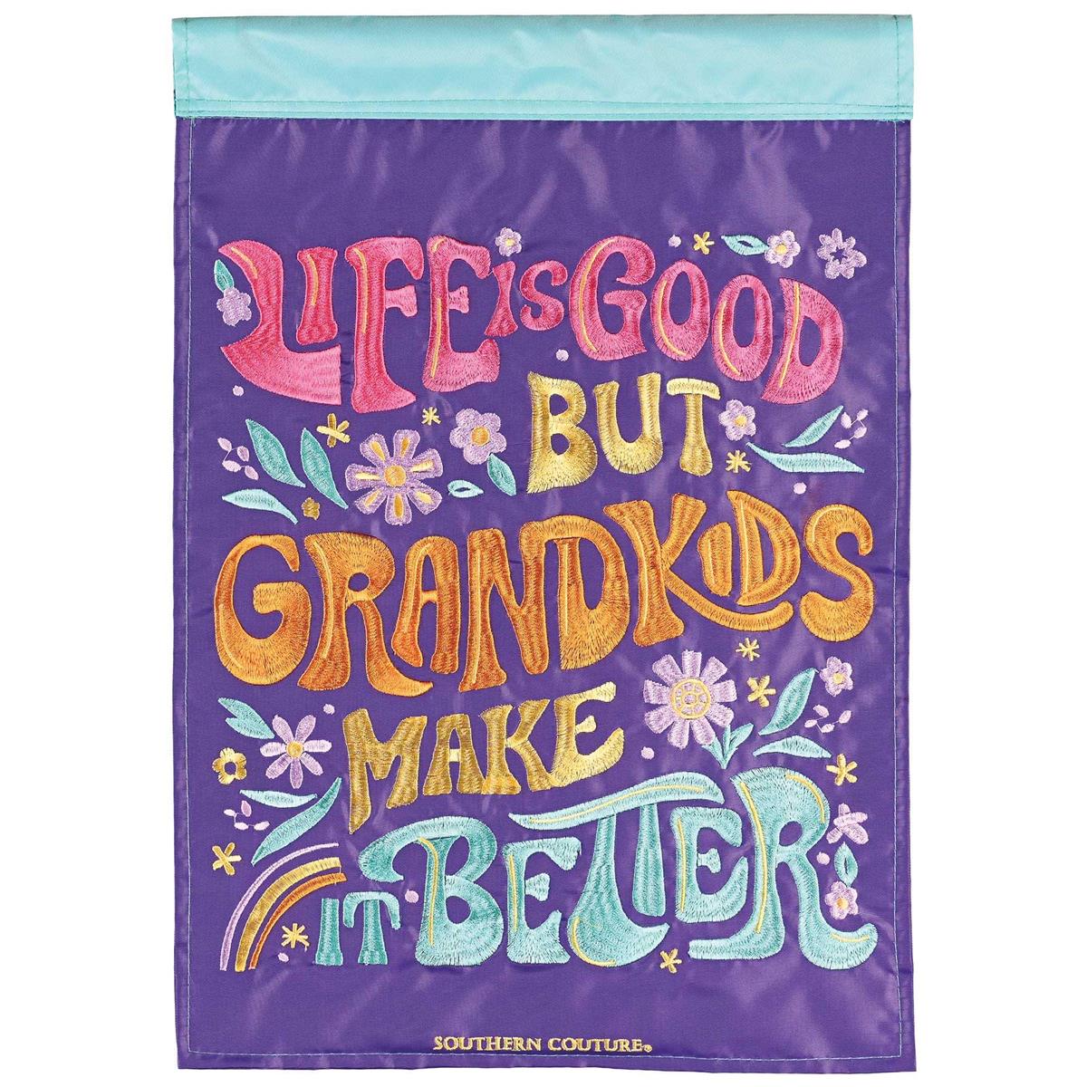 Life Is Good But Grandkids double-sided garden flag featuring fabric appliques and embroidery in an outdoor garden setting.