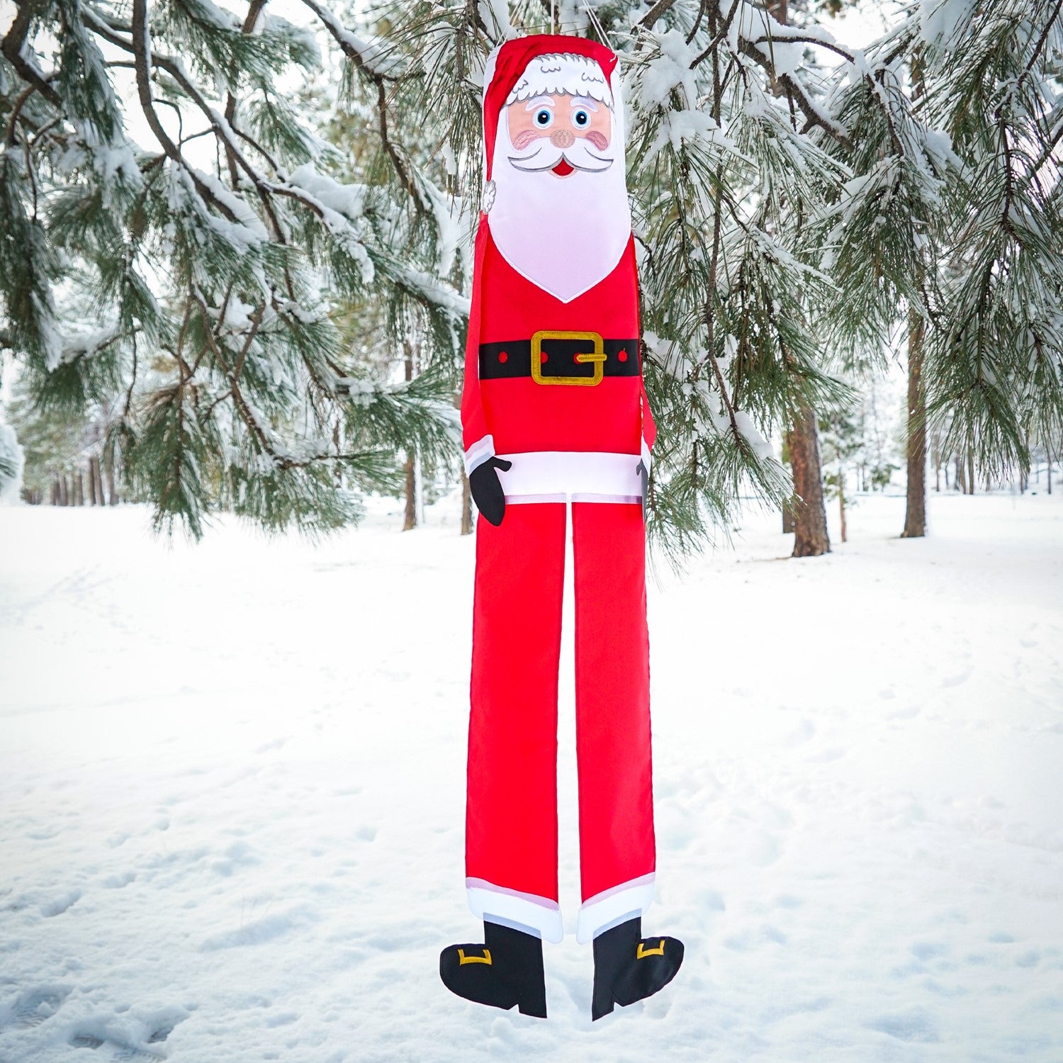 Lil' Santa Claus 3D 40" Windsock with vibrant colors, complete with free-flowing arms and tails, hanging outdoors to celebrate the holiday season.