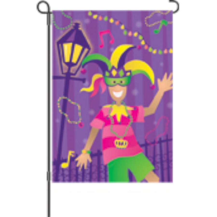 28 in. Mardi Gras Time house flag displaying vibrant colors and festive patterns, hung on an outdoor flagpole in a spring setting.