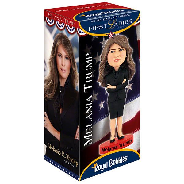 Melania Trump Bobblehead standing 7 inches tall, showcasing intricate details of her elegant attire and signature hairstyle on a display shelf.