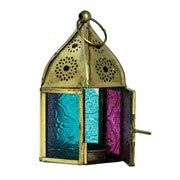 Mini Teal & Pink Pentagon Glass Tealight Lantern showcasing a vibrant design with textured glass panels and metal accents in a cozy indoor setting.