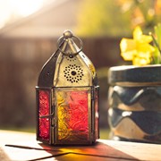 Mini Yellow & Pink Pentagon Glass Tealight Lantern showcasing vibrant colors and intricate designs to illuminate any setting beautifully.