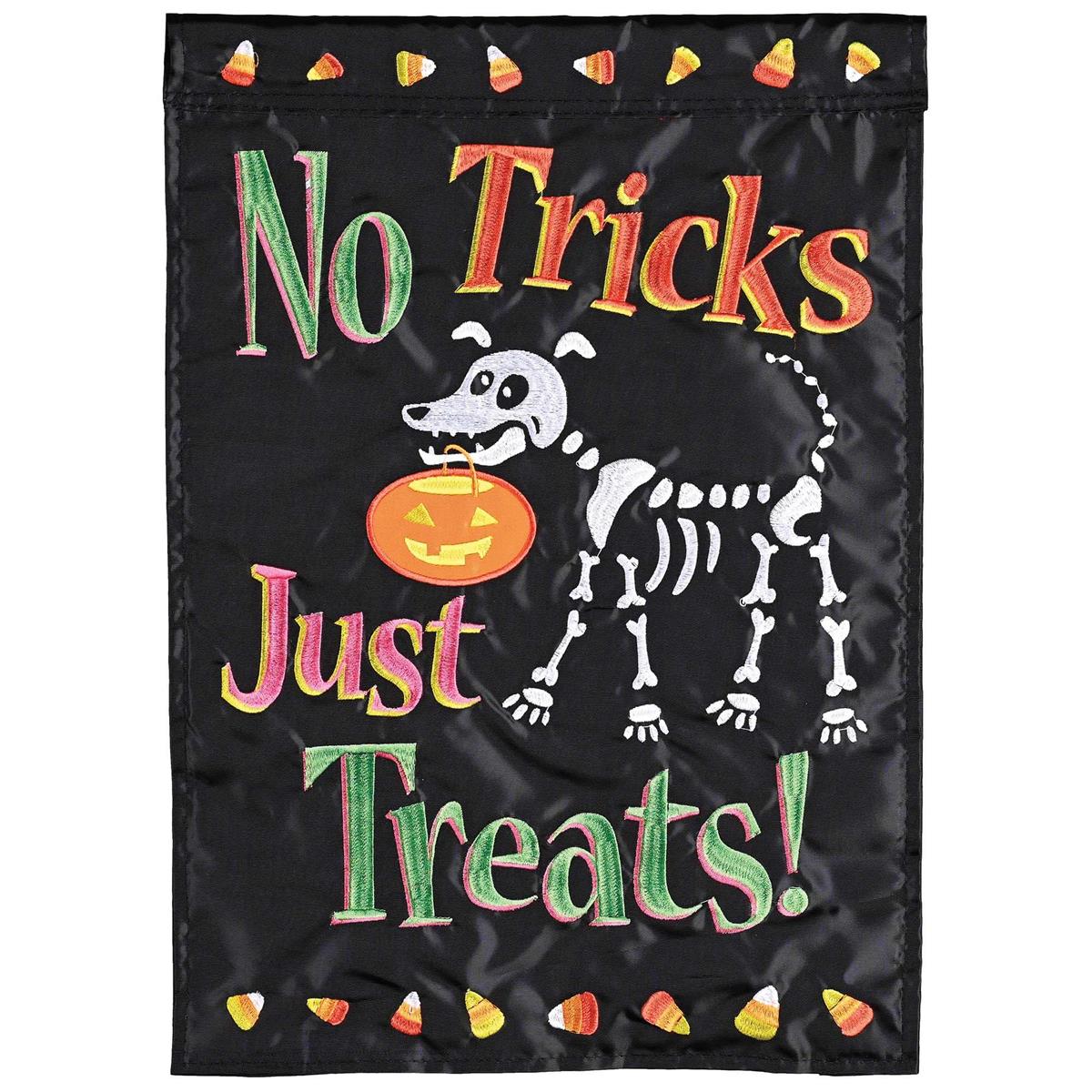 No Tricks Just Treats garden flag featuring cheerful Halloween designs displayed in a front yard setting, showcasing vibrant colors and detailed embroidery.