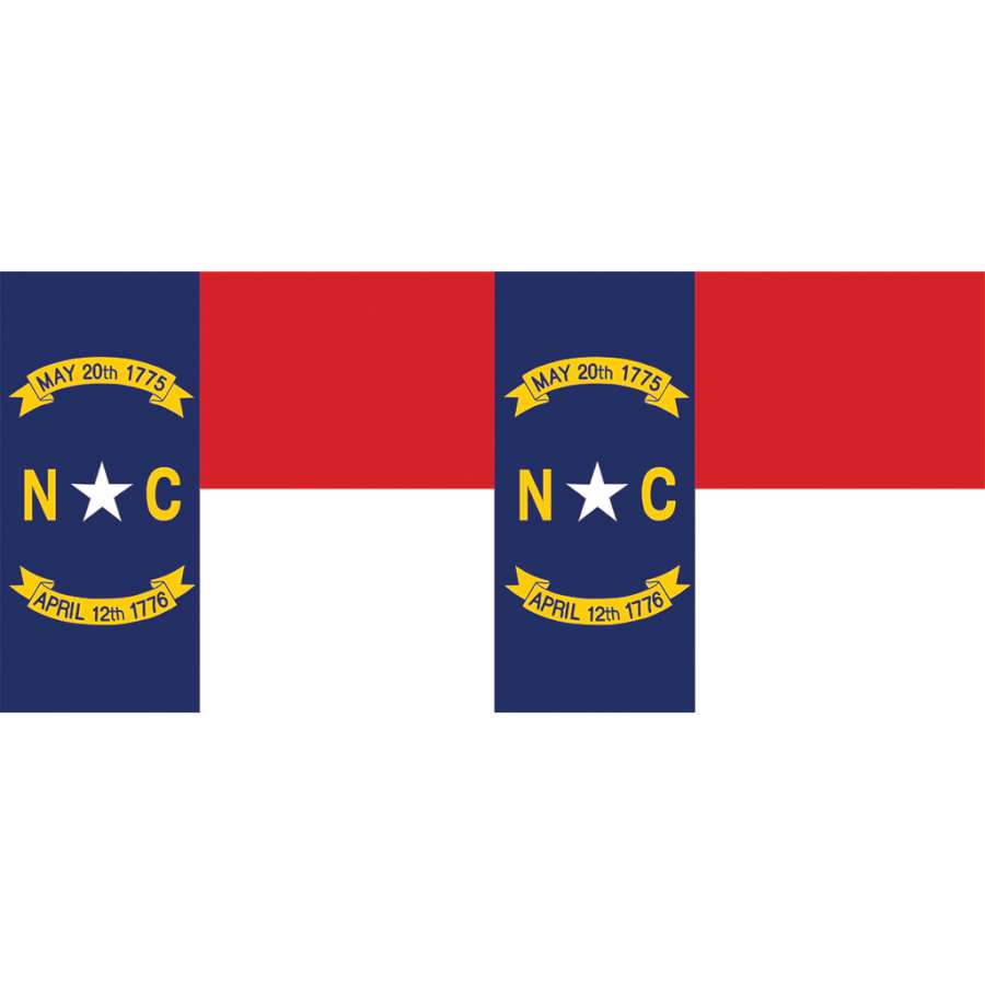 North Carolina windsock displaying bright colors and traditional design, hanging outdoors in a garden setting, showcasing state pride.