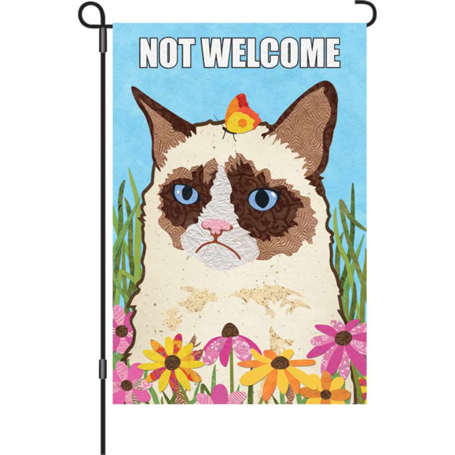 12 in. 'Not Welcome' garden flag made from velvety PremierSoft fabric, featuring a playful design, displayed outdoors in a garden setting.