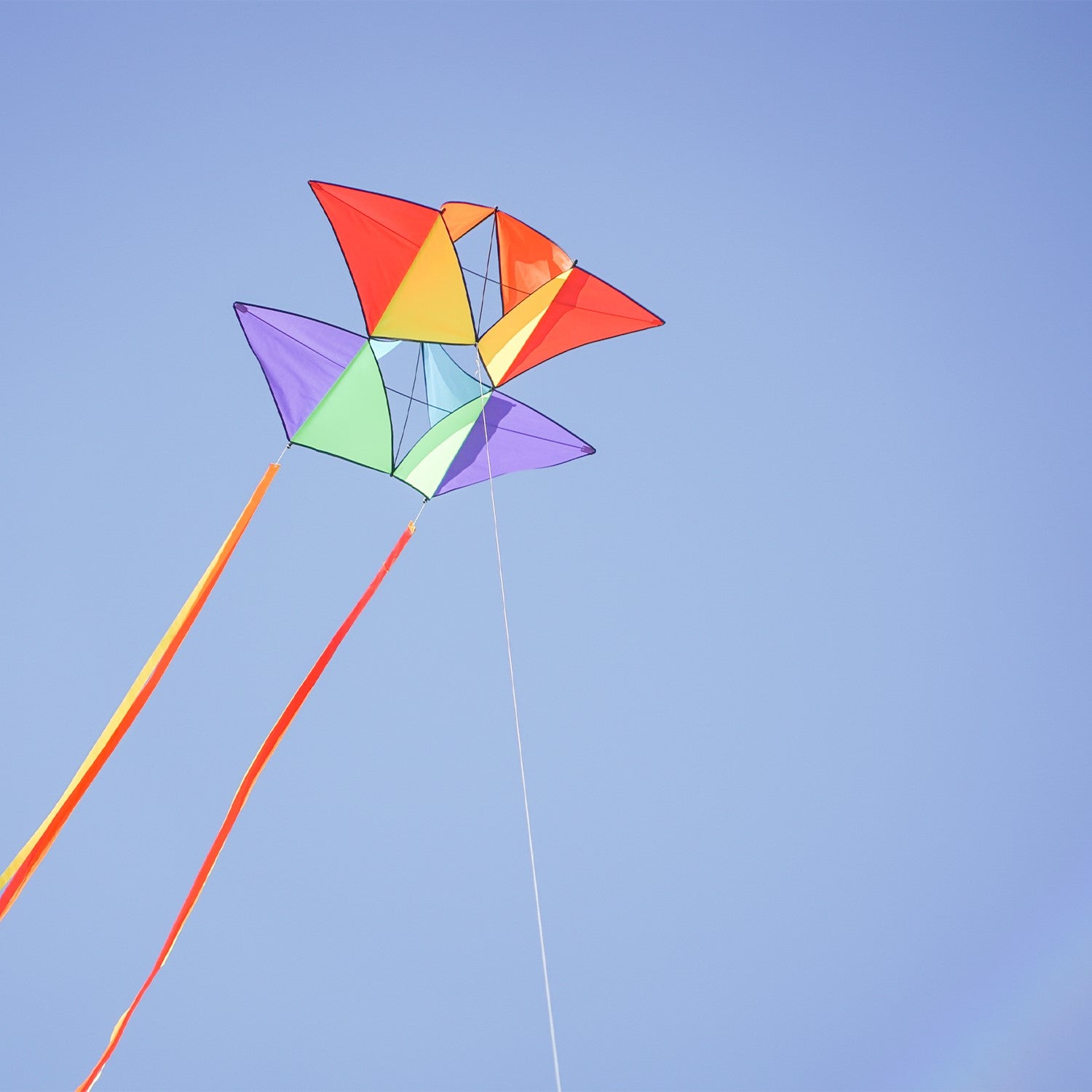 Pacific Tri-Kite featuring a vibrant design and durable materials, ready to fly easily and effectively for outdoor fun in various wind conditions.