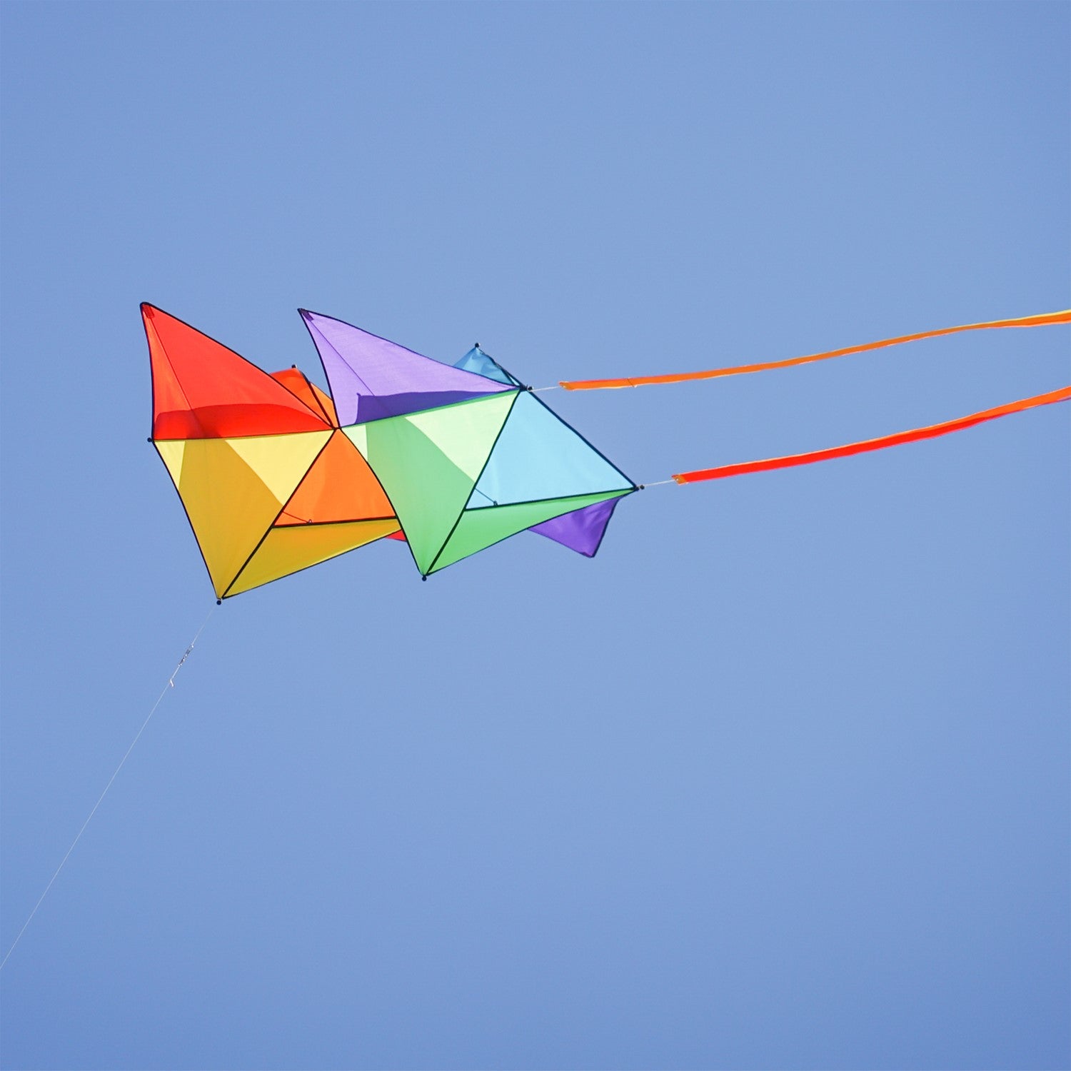Pacific Tri-Kite featuring a vibrant design and durable materials, ready to fly easily and effectively for outdoor fun in various wind conditions.