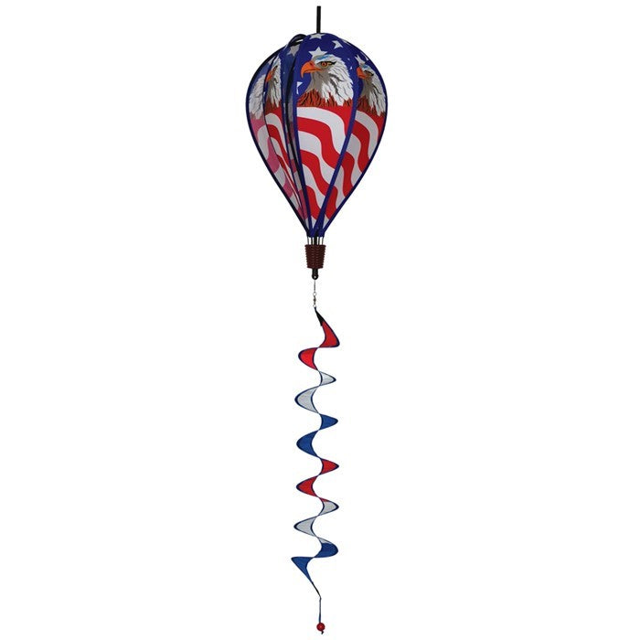 Patriot Eagle Hot Air Balloon kinetic spinner featuring a regal bald eagle against an American flag, displayed in a garden setting.