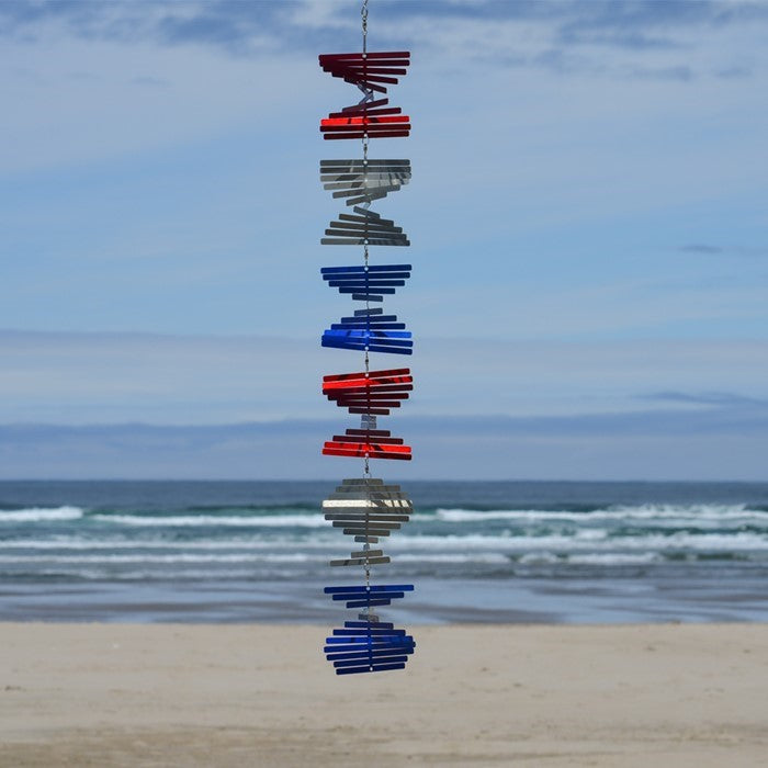 The Patriot Stacked Shimmer Helix Spinner showcases a stunning design in red, white, and blue, perfect for adding a festive touch to outdoor settings.
