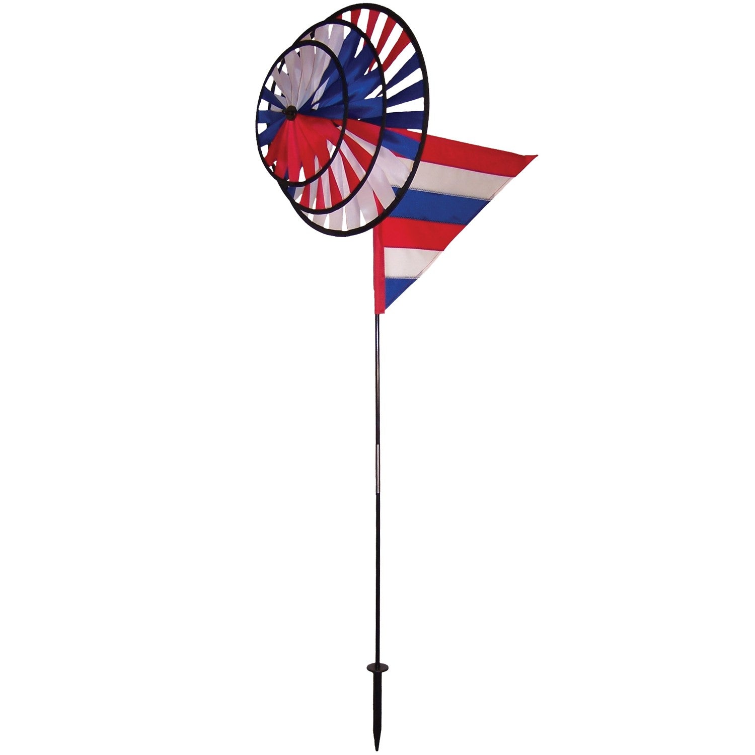 Patriot Wind Sail Triple Wheel Spinner with three colorful wheels and an applique windsail, displayed in an outdoor garden setting, showcasing red, white, and blue colors.