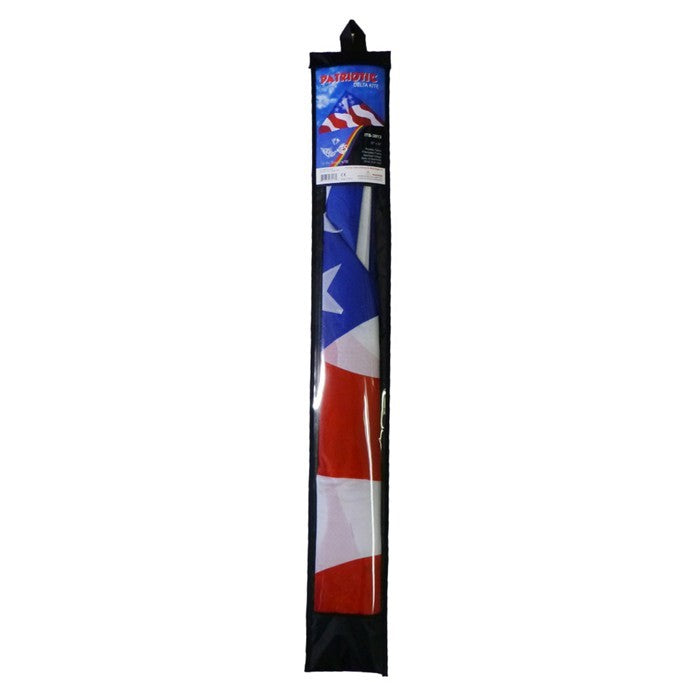 Patriotic 57 inch Delta Kite with red, white, and blue stars and stripes design soaring high in the blue sky against a sunny backdrop.