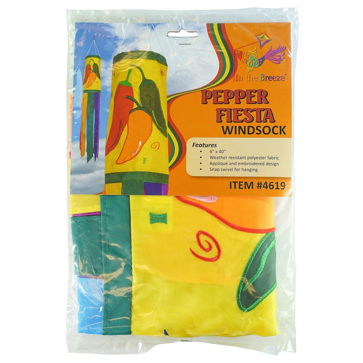 A colorful Pepper Fiesta 40" windsock featuring cheerful chili peppers and fluttering tails hanging gracefully in an outdoor garden setting.