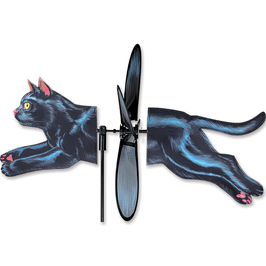 Petite Spinner - Black Cat spinning gracefully in a garden setting, showcasing vibrant colors and playful design, perfect for outdoor decor.