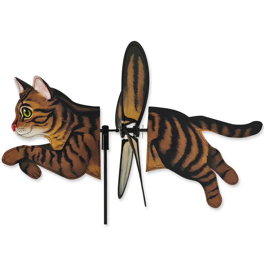 Petite Spinner featuring a brown tabby cat design, spinning gently in a garden setting, showcasing vibrant colors and motion.