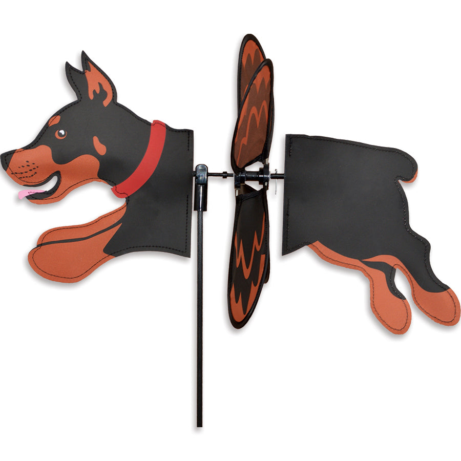 Petite Spinner featuring a Doberman design in a garden, with wings that spin gracefully in the breeze, made from durable polyester fabric.