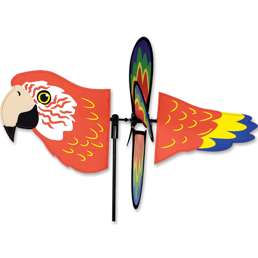 Petite Spinner - Flying Parrot garden spinner features colorful parrot wings spinning gently in the breeze, enhancing outdoor decor in a garden setting.