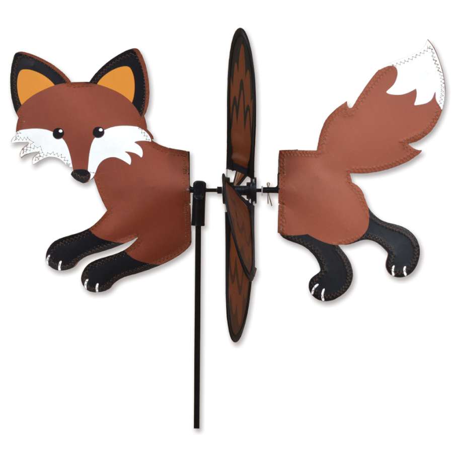 Petite Spinner - Fox displayed in a garden setting, showcasing vibrant colors and a playful design against a serene backdrop.
