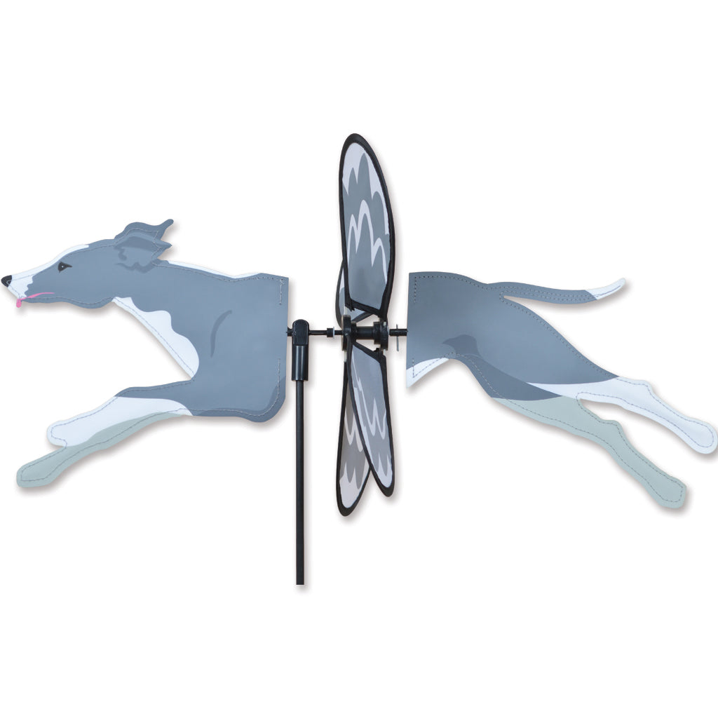 Petite Spinner Greyhound Dog design spinning in an outdoor garden setting, showcasing vibrant colors and durable construction.