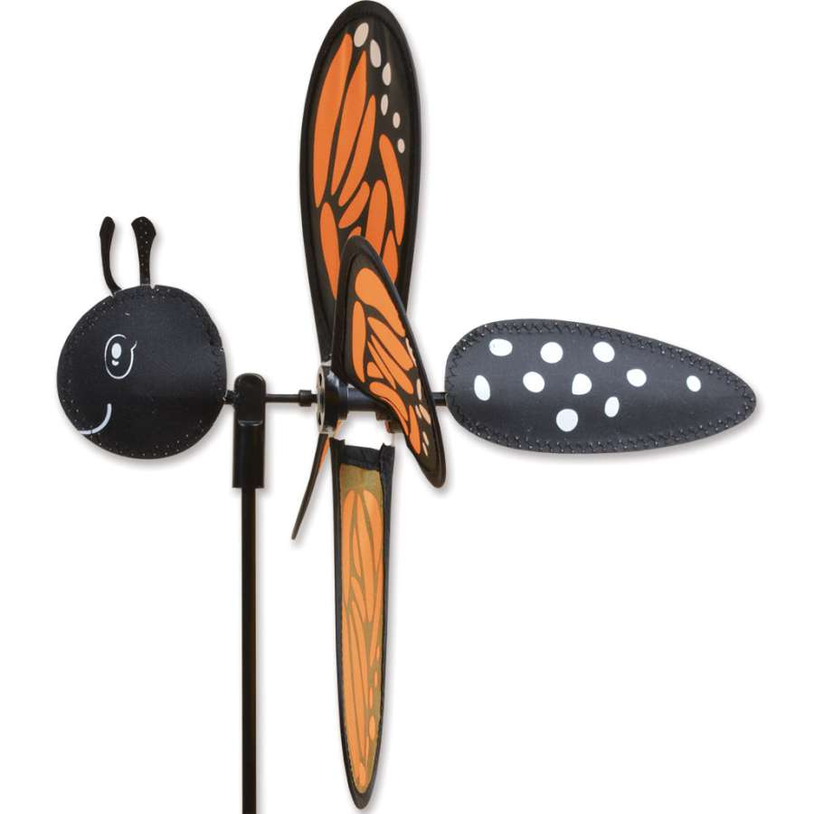 Petite Spinner - Monarch featuring colorful butterfly wings spinning in the breeze, enhancing the beauty of an outdoor garden setting.