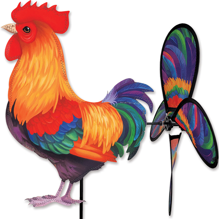 Petite Spinner - Morning Rooster spinning gently in a garden, showcasing a colorful rooster design against greenery.