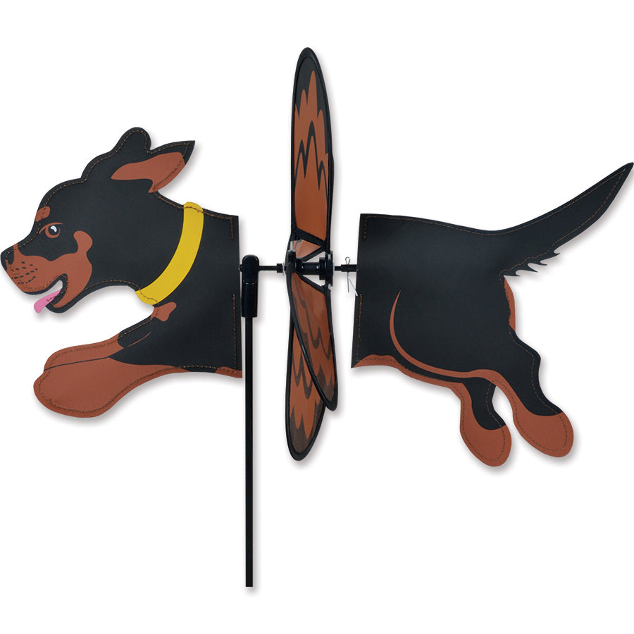 Petite Spinner - Rottweiler garden decoration spinning gracefully in a flower garden with vibrant colors and playful design.