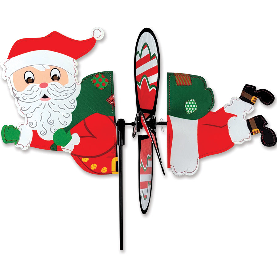 Petite Spinner featuring Santa Claus design spinning in the garden, adding festive charm to the outdoor space.