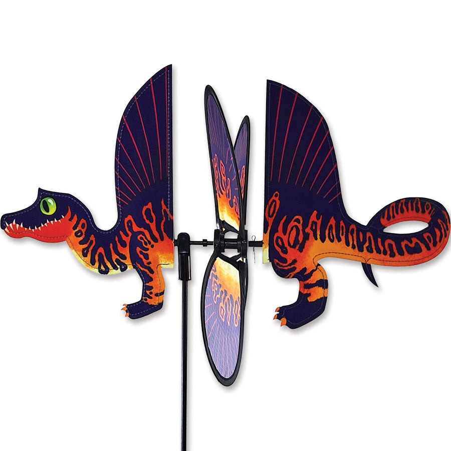 Petite Spinner featuring a colorful Spinosaurus design spinning in a garden, capturing the joy and whimsy of outdoor decor.