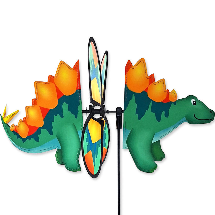 Petite Spinner - Stegosaurus in vibrant colors, spinning gracefully in a garden setting with flowers around it.