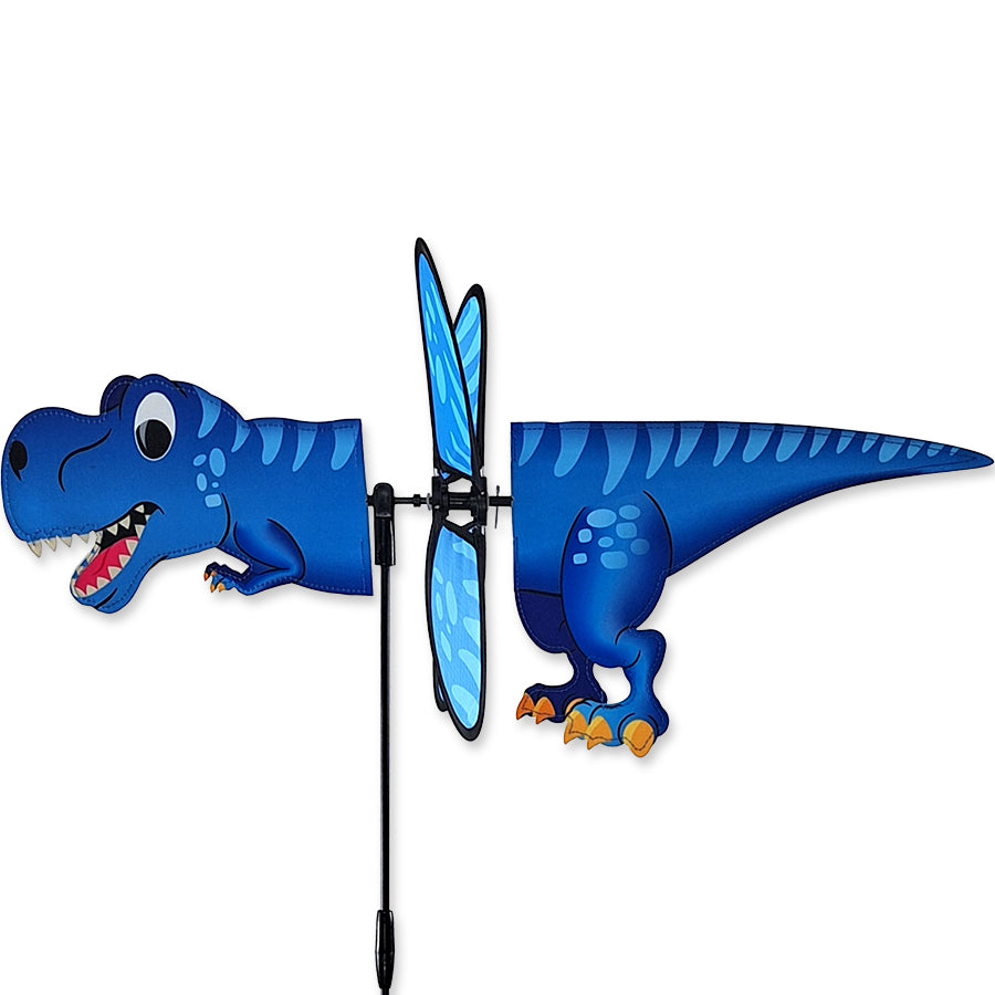 Petite Spinner - Tyrannosaurus Rex designed for outdoor display, featuring colorful spinning wings in a garden setting.