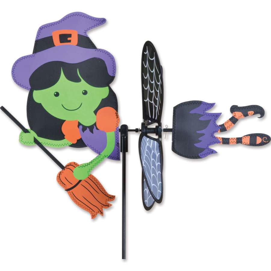 Petite Spinner - Witch with colorful wings spinning in the breeze, adding a whimsical touch to an outdoor garden setting.