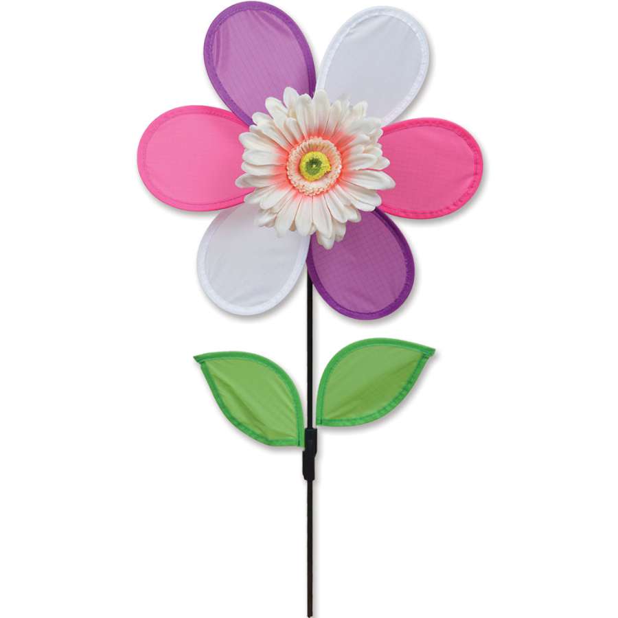 Pink Daisy Spinner with vibrant petals rotating in the wind, enhancing the beauty of an outdoor garden setting.
